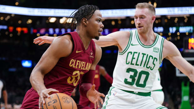 Dec 12, 2023; Boston, Massachusetts, USA; Cleveland Cavaliers forward Isaac Okoro (35) drives the ball against Boston Celtics forward Sam Hauser (30) in the first quarter at TD Garden. Mandatory Credit: David Butler II-USA TODAY Sports